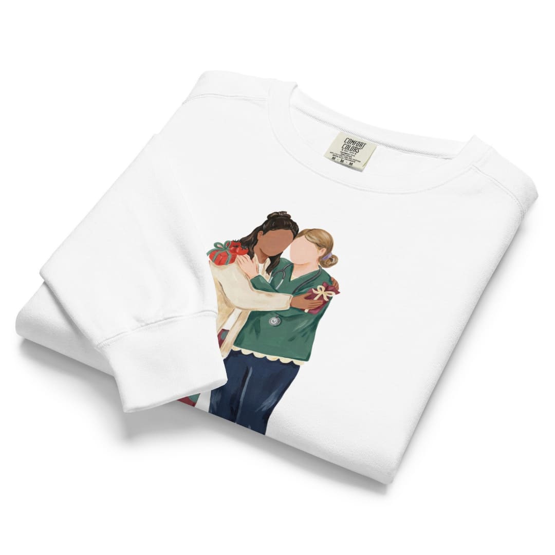 Charted With Love™ sweatshirt by Blossombless.co in White, folded to show the heavyweight fleece and the painterly nurse friends graphic