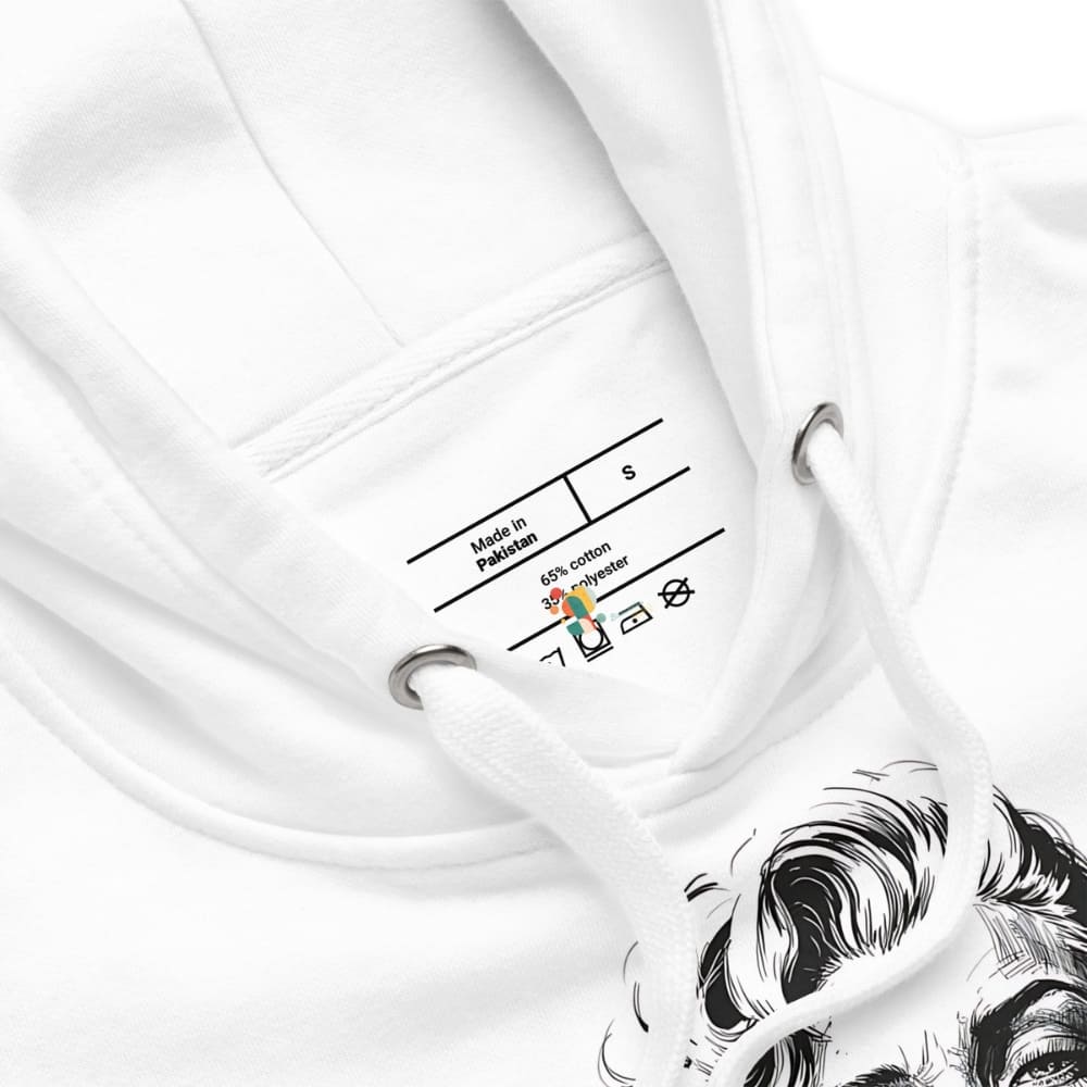 Close-up of a white garment with a label and a hook, featuring a brand logo.