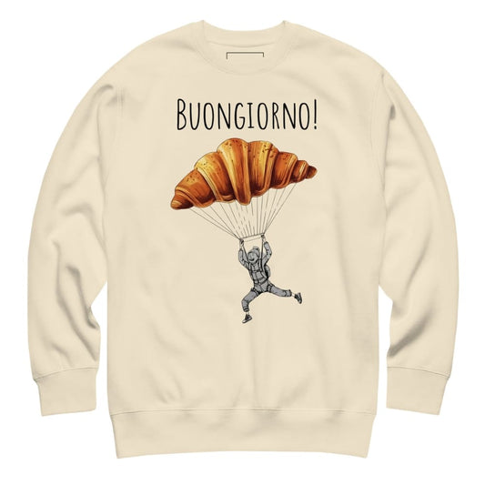 Beige sweatshirt with a graphic of a croissant on a parachute and 'Buongiorno!' text.