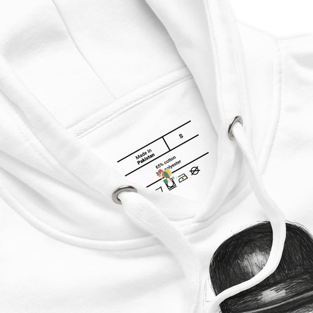 Close-up of a white garment with a label on a white background