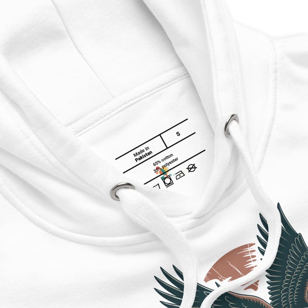 Close-up of a white garment with a label and a design on a white background