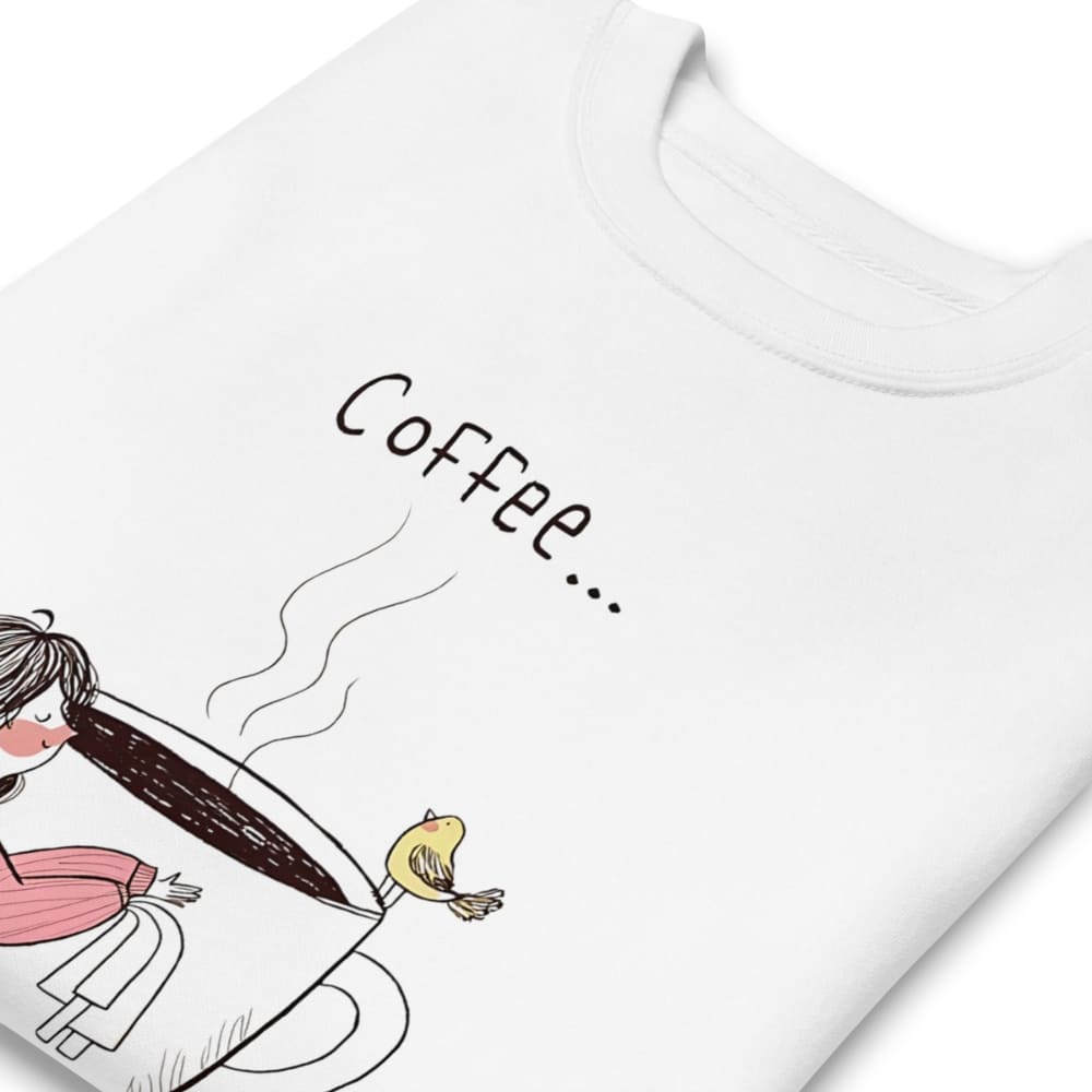 White t-shirt with a cartoon design of a person holding a coffee cup and text 'Coffee...' on a white background.