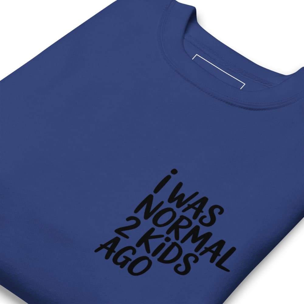Blue t-shirt with black text 'I WAS NORMAL 2 KIDS AGO' on a white background