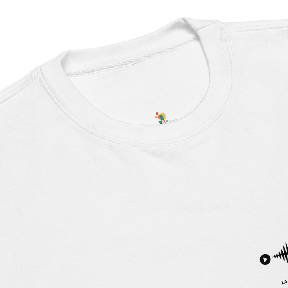 Close-up of a white shirt with a small embroidered design on a white background