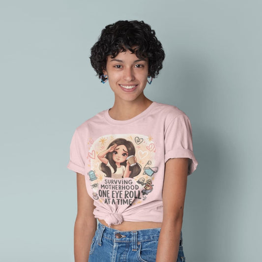 Person wearing a pink t-shirt with a graphic design and text, standing against a plain background