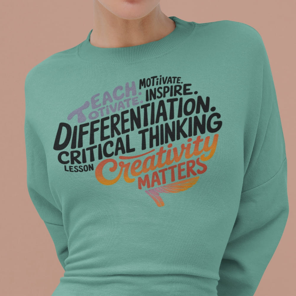Teal sweatshirt with motivational text on a beige background