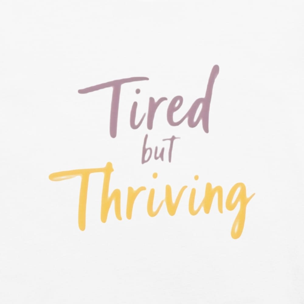 Garment-dyed relaxed fit t-shirt with motivational quote “Tired But Thriving” in modern handwritten script