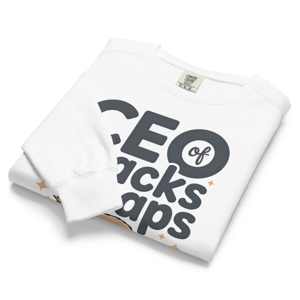 "CEO of Snacks & Naps" printed sweatshirt featuring a sloth in a crown surrounded by pretzels and plushies on vintage-washed cotton fleece
