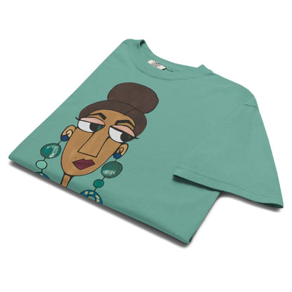 Green t-shirt with a graphic of a stylized face on a white background