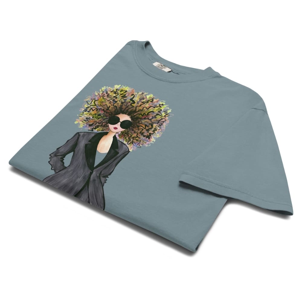 Ice-blue t-shirt with a graphic of a woman with flowers in her hair on a white background