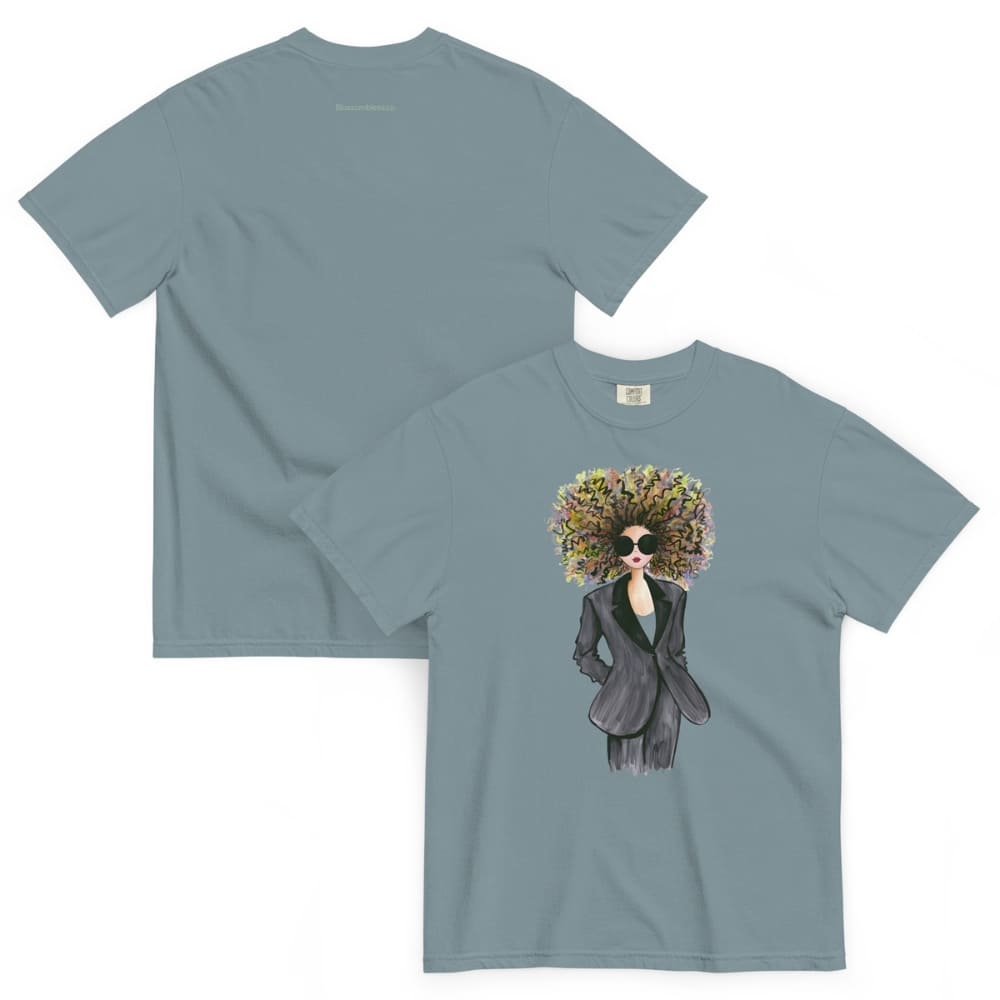 Ice-blue t-shirt with a graphic design of a woman with a floral headpiece on a white background
