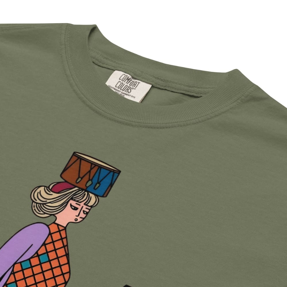 Moss green t-shirt with a colorful graphic of a person holding a drum, brand label visible.