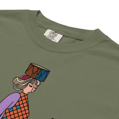 Moss green t-shirt with a colorful graphic of a person holding a drum, brand label visible.