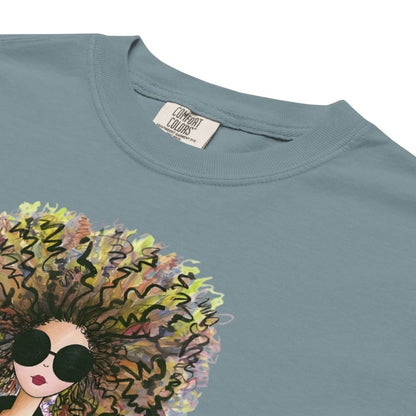 Ice-blue t-shirt with a colorful graphic of a woman's face and sunglasses on a white background.