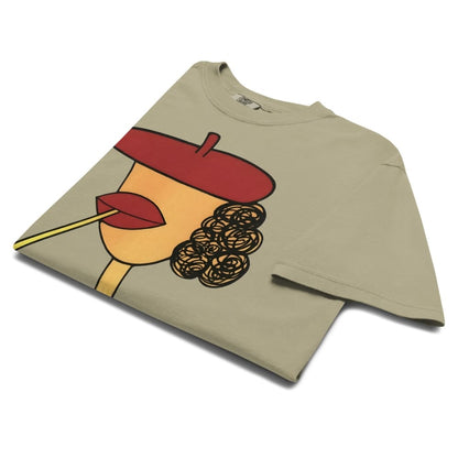 Khaki t-shirt with a graphic design of a face wearing a red beret and holding a cigarette on a white background.