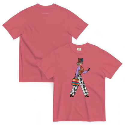 Watermelon red t-shirt with a graphic design of a person walking on the front, displayed against a white background.