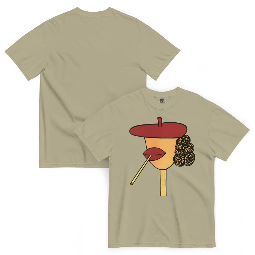 Khaki t-shirt with a graphic design of a face wearing a red beret, yellow face, and black hair on a white background.