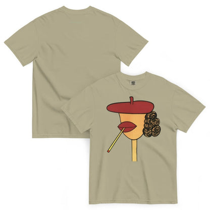 Khaki t-shirt with a graphic design of a face wearing a red beret, yellow face, and black hair on a white background.