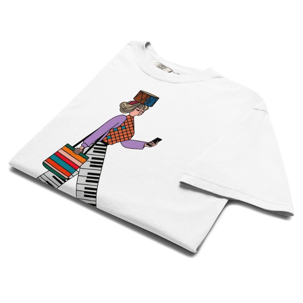 White t-shirt with a colorful graphic design of a person playing a keyboard on a white background