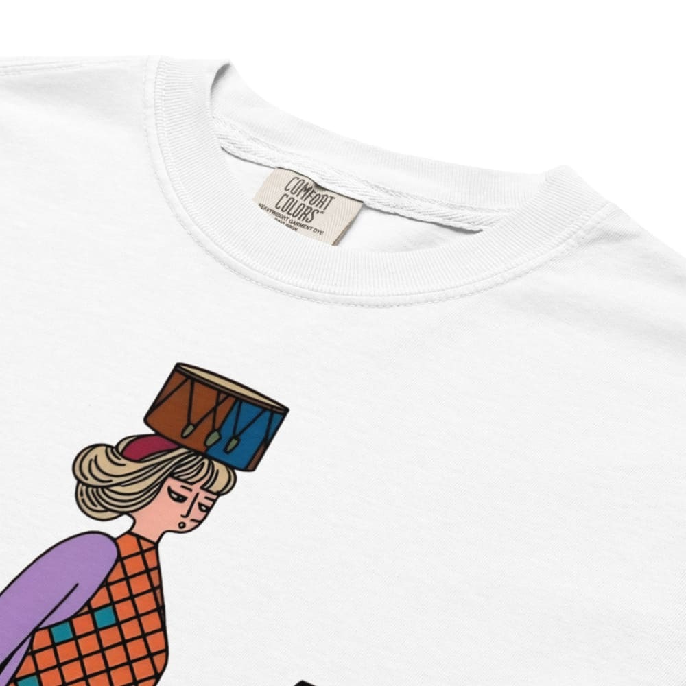 White t-shirt with a colorful graphic of a person holding a drum, brand label visible.
