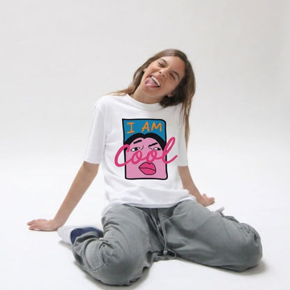 Person wearing a white t-shirt with a colorful graphic and text, sitting on a white background