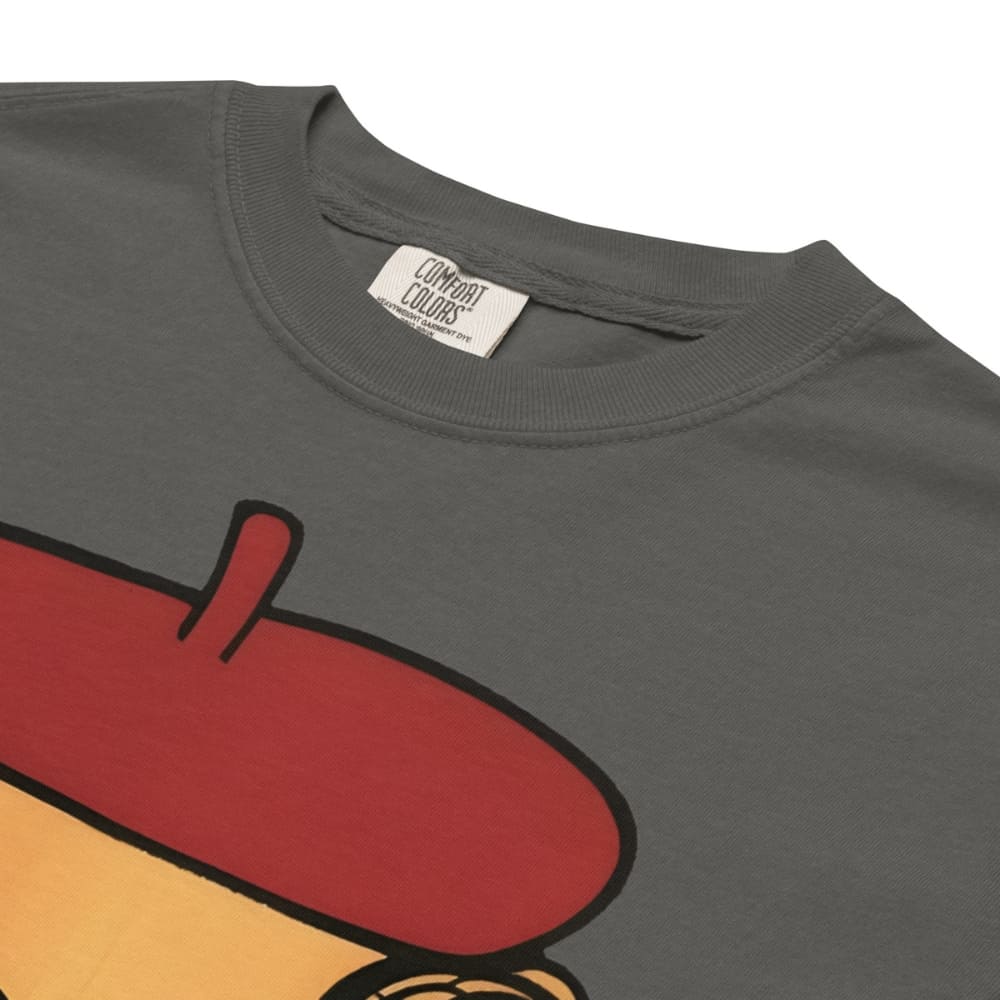 Pepper-gray t-shirt with a cartoon character wearing a red beret and yellow outfit, featuring Comfort Colors label.