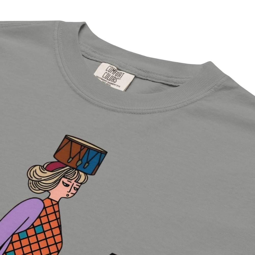 Gray t-shirt with a colorful graphic of a person holding a drum on a white background