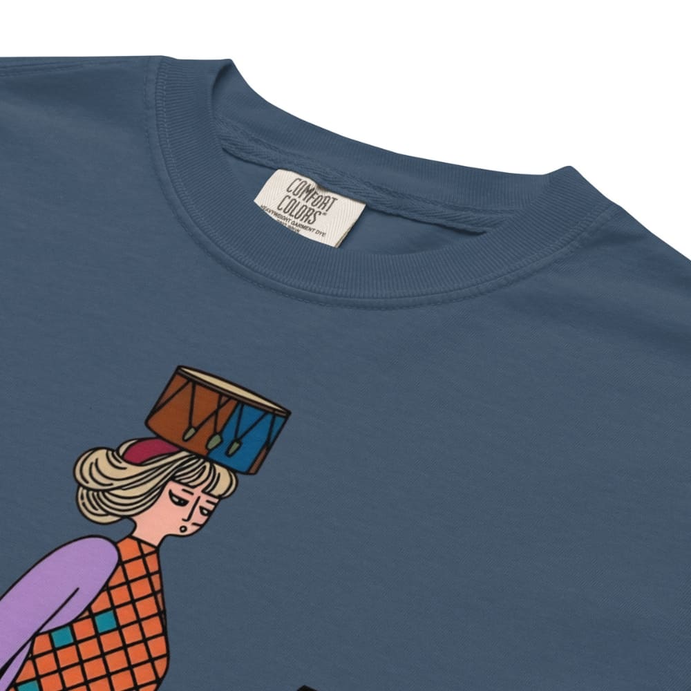Midnight blue t-shirt with a colorful graphic of a person holding a drum on a white background