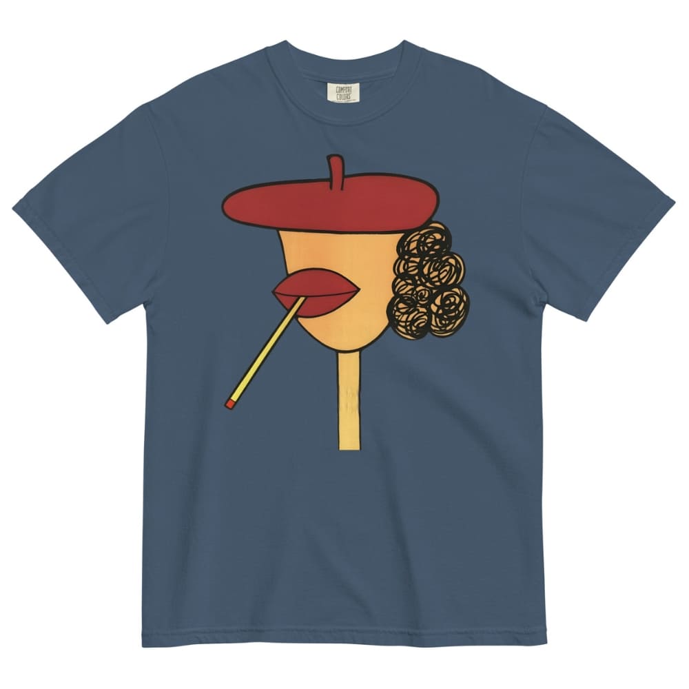 Midnight-blue t-shirt with a stylized face design featuring a red beret, yellow face, red lips, and black hair on a white background.