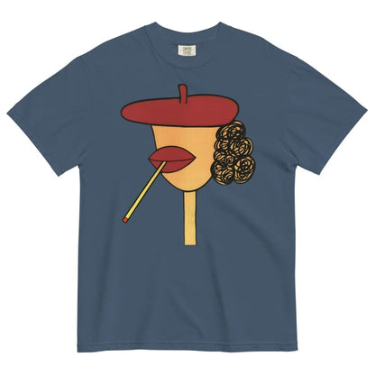 Midnight-blue t-shirt with a stylized face design featuring a red beret, yellow face, red lips, and black hair on a white background.