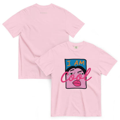 Pink t-shirt with graphic design and text 'I AM Cool' on a white background