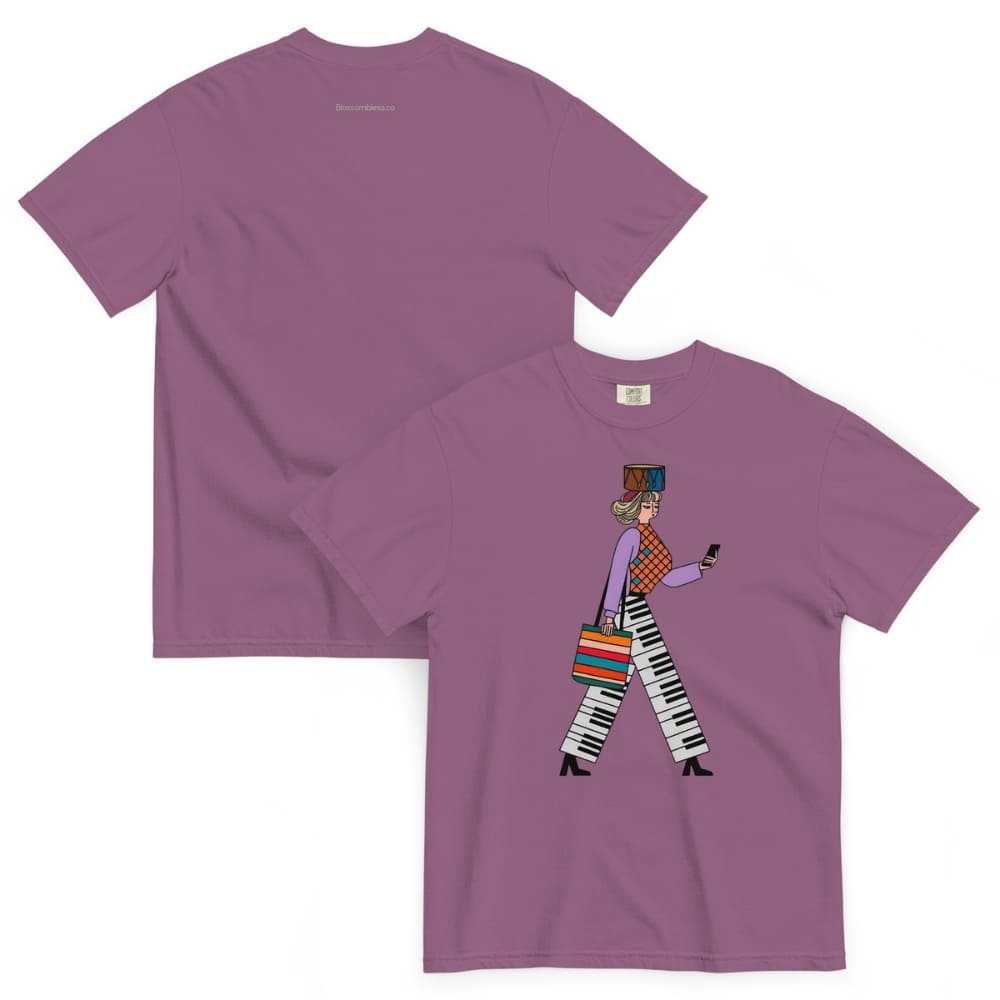 Berry purple t-shirt with a graphic design of a person walking and using a phone, displayed on a white background.