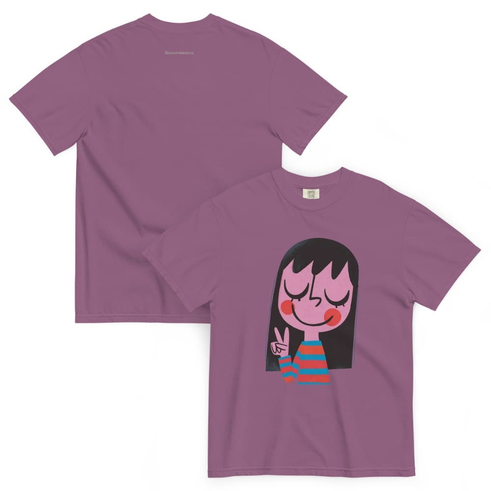 Purple t-shirt with a cartoon character on a white background