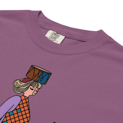 Berry purple t-shirt with a graphic of a person holding a drum on their head, featuring 'Comfort Colors' label.