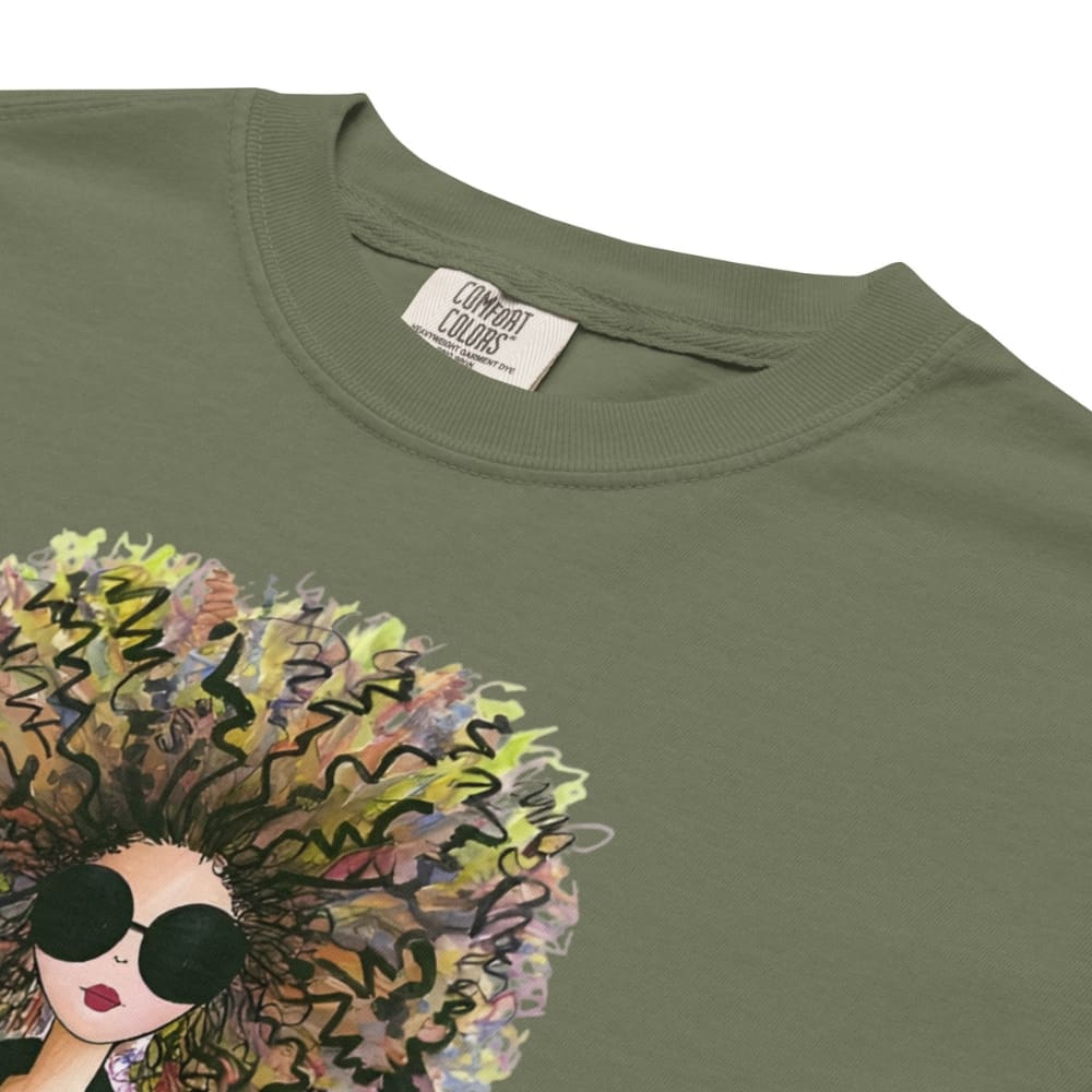 Moss-green t-shirt with a colorful graphic of a woman's face and sunglasses on a white background.