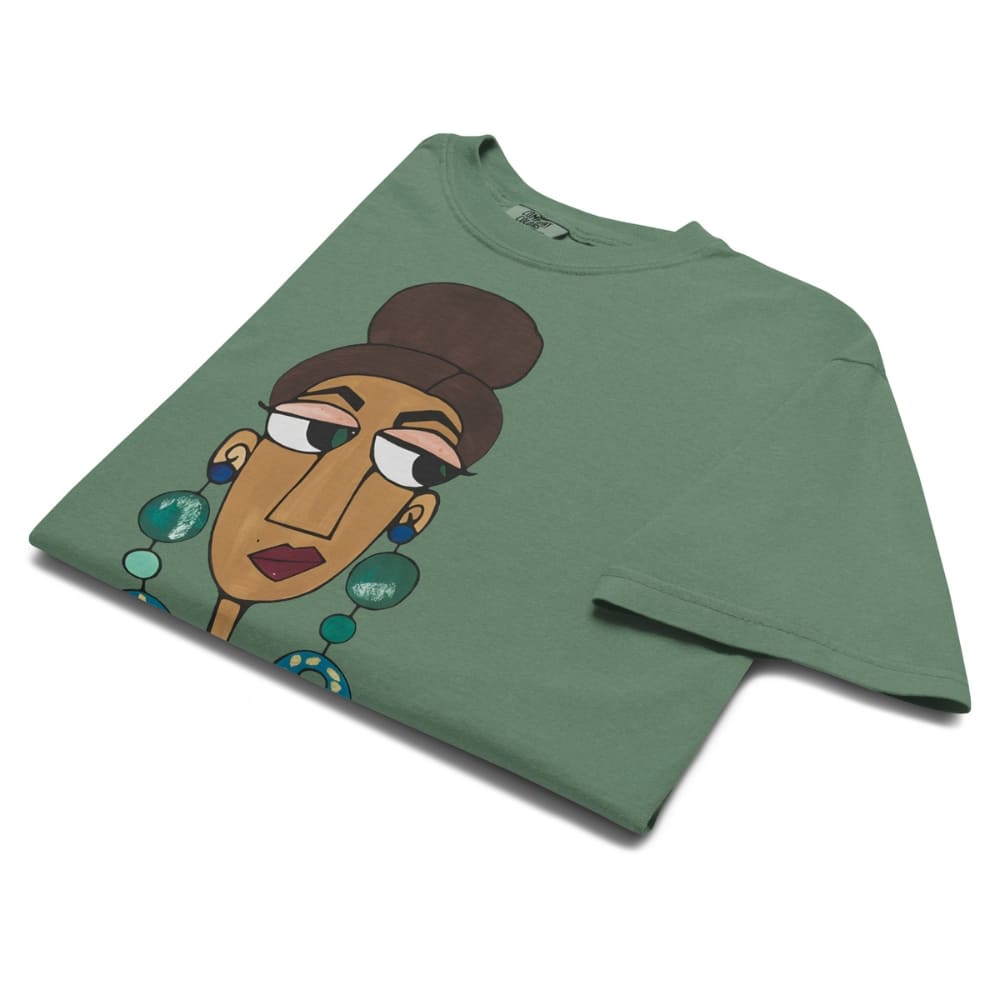 Green t-shirt with a graphic of a stylized face on a white background