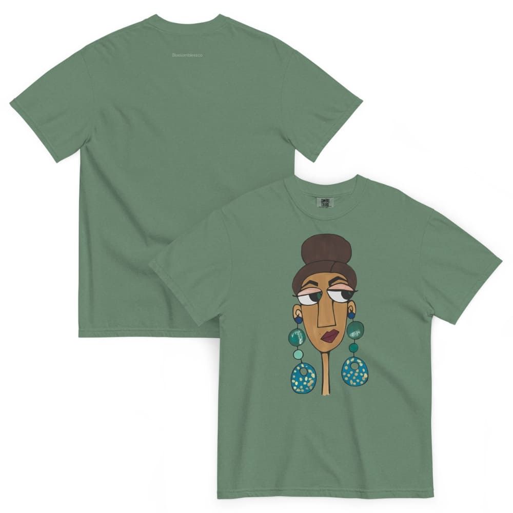 Green t-shirt with a graphic of a woman's face and earrings on a white background