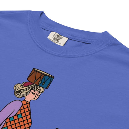 Flo blue t-shirt with a colorful graphic of a person holding a drum on a white background