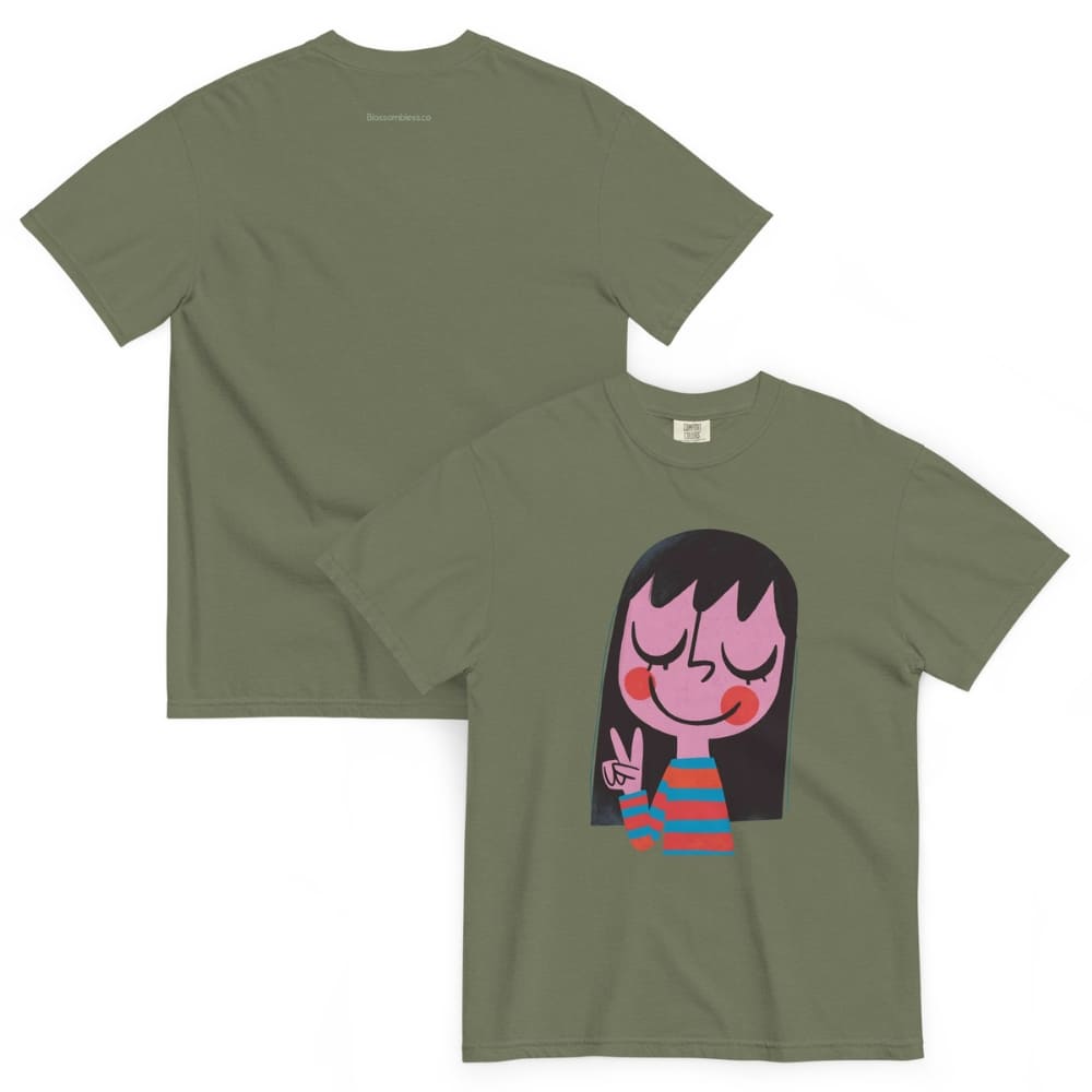Green t-shirt with a cartoon character design on a white background