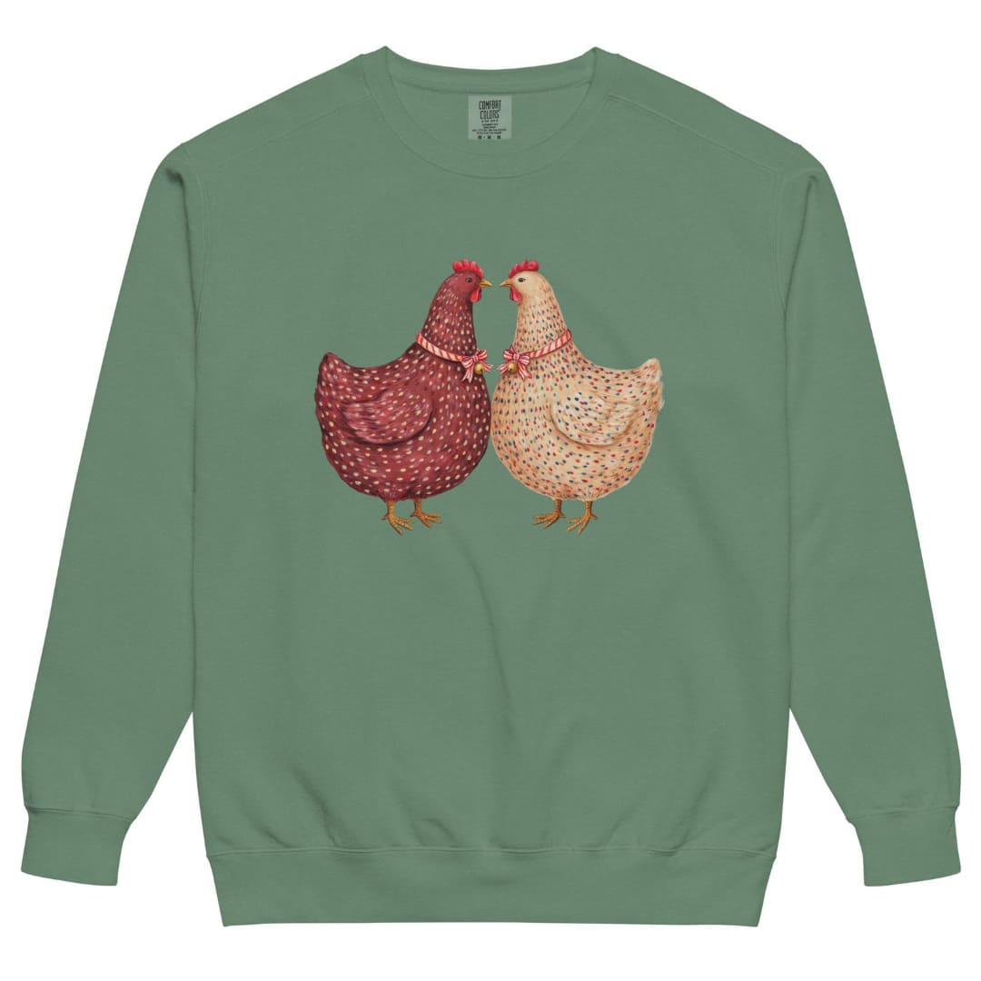 Belle & Plume™ sweatshirt by Blossombless.co in Light Green, front view: two painterly French hens, one burgundy and one cream, beak to beak with striped ribbon bows and tiny gold bells