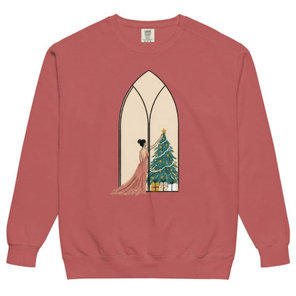 Star of the Season™ sweatshirt by Blossombless.co in Crimson, front view: a soft pastel illustration of a woman in a backless rose gown placing a gold star on a Christmas tree, framed inside an ivory gothic arched window