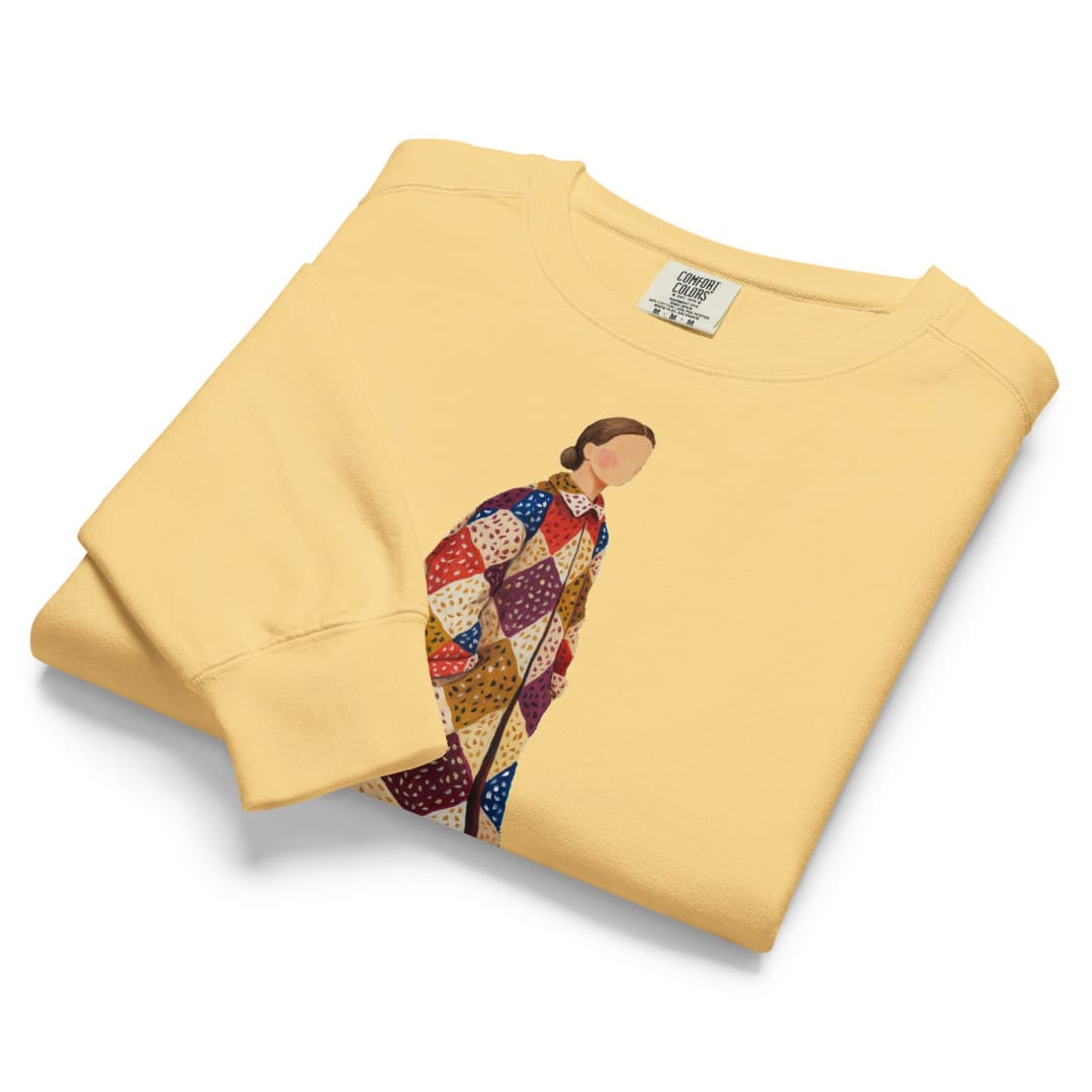 Pieced Together™ sweatshirt by Blossombless.co in Butter, folded to show the heavyweight fleece and the patchwork coat graphic