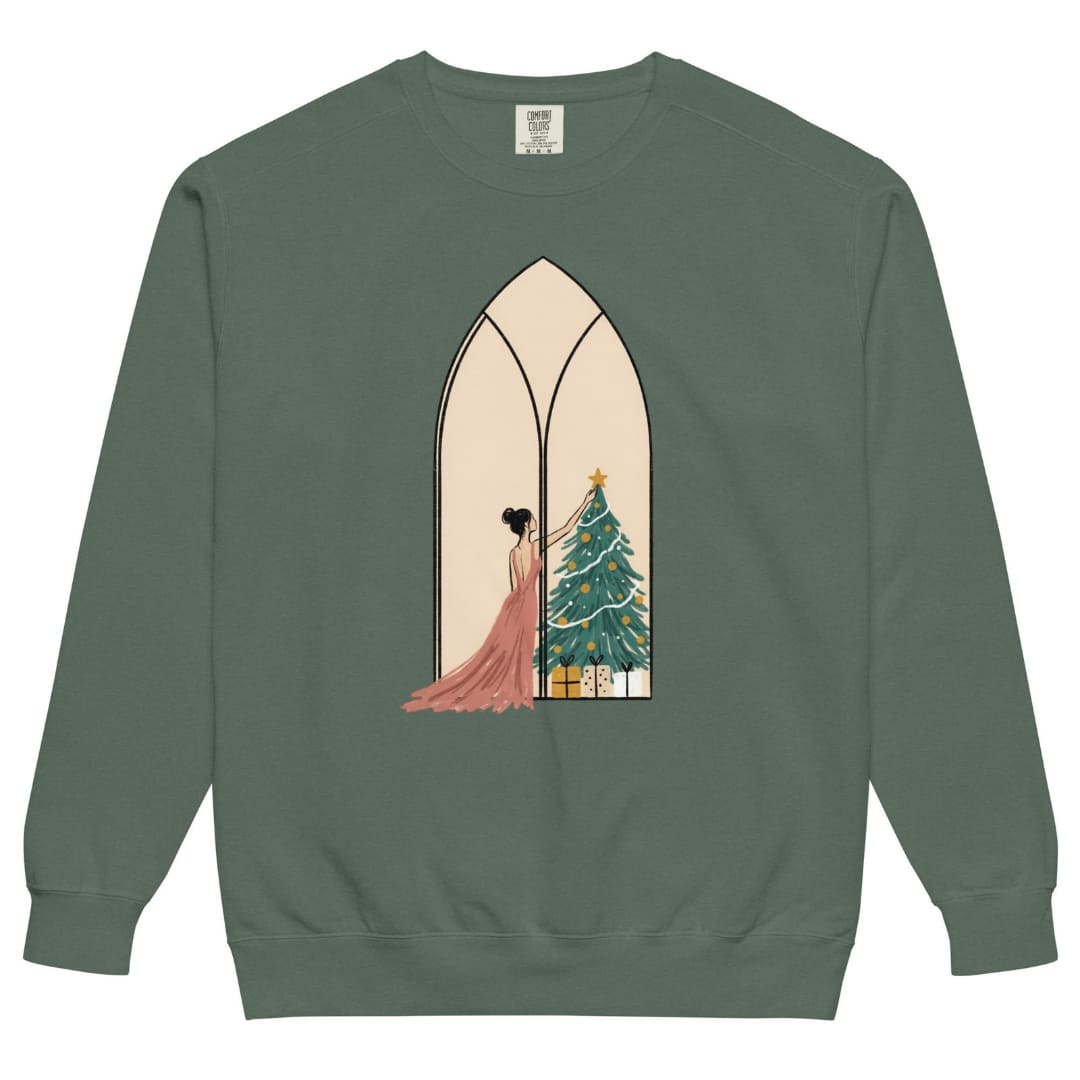 Star of the Season™ sweatshirt by Blossombless.co in Blue Spruce, front view: a soft pastel illustration of a woman in a backless rose gown placing a gold star on a Christmas tree, framed inside an ivory gothic arched window