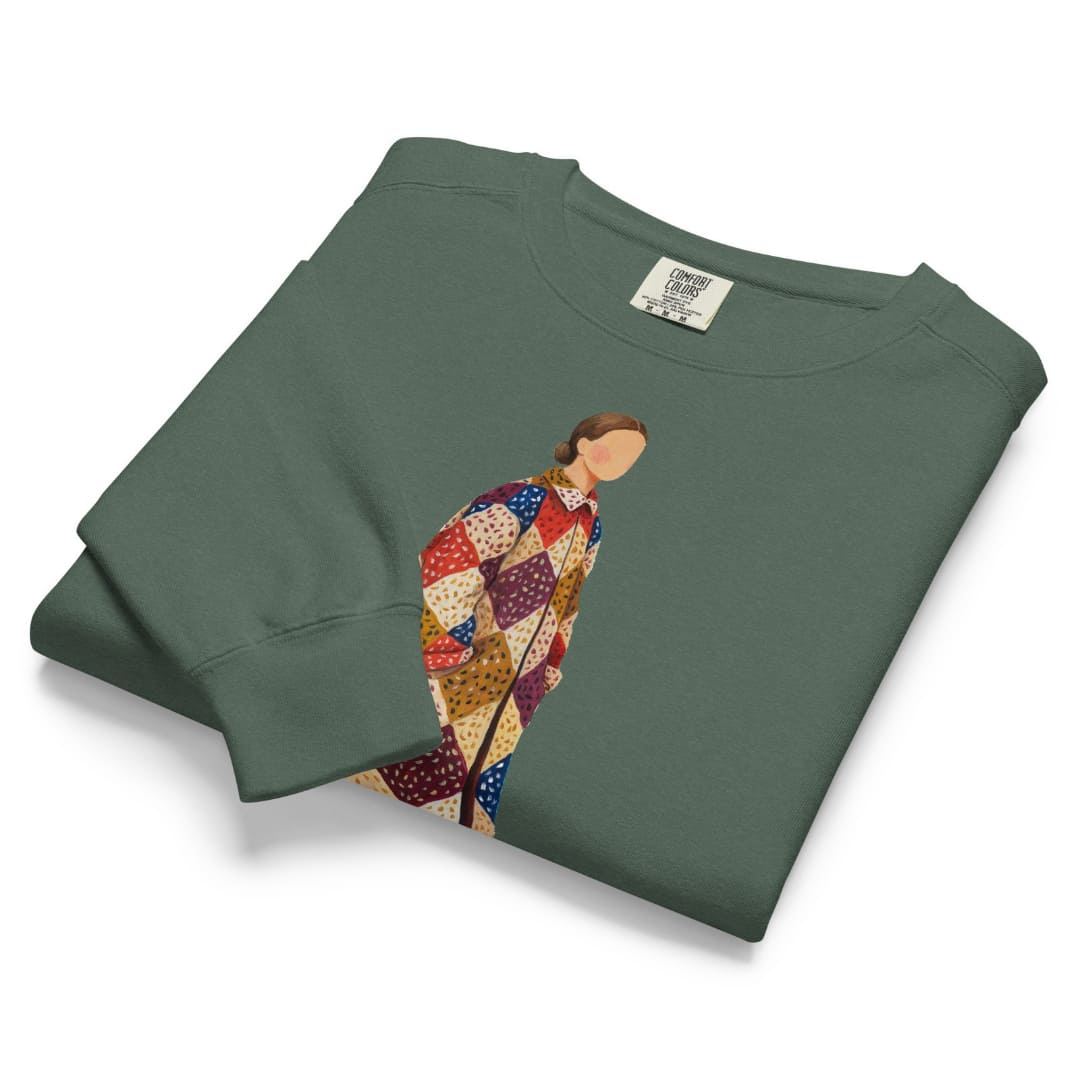 Pieced Together™ sweatshirt by Blossombless.co in Blue Spruce, folded to show the heavyweight fleece and the patchwork coat graphic