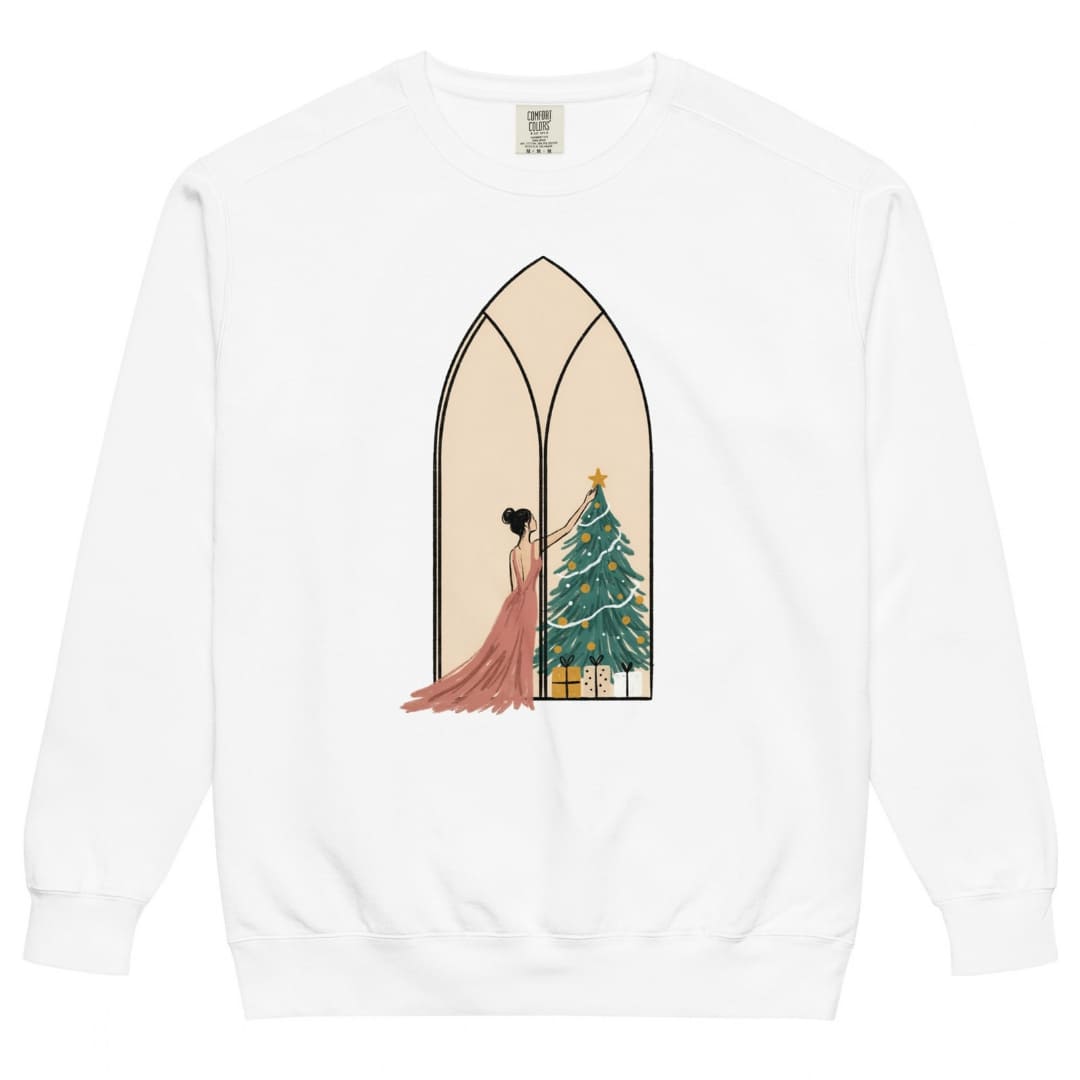 Star of the Season™ sweatshirt by Blossombless.co in White, front view: a soft pastel illustration of a woman in a backless rose gown placing a gold star on a Christmas tree, framed inside an ivory gothic arched window