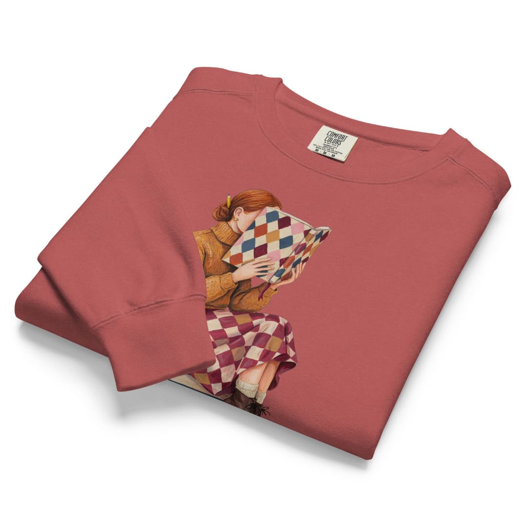 Between Chapters™ sweatshirt by Blossombless.co in Crimson, folded to show the heavyweight fleece and the painterly reading graphic