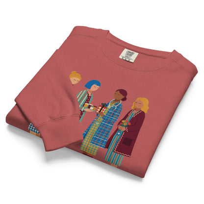 Holiday Handoff™ sweatshirt by Blossombless.co in Crimson, folded to show the heavyweight fleece and nurses graphic