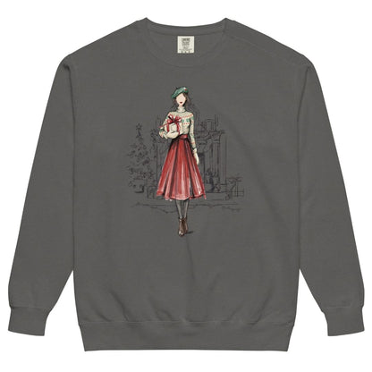 Holiday Muse™ sweatshirt by Blossombless.co in Pepper, front view: a sketch-style watercolor illustration of a faceless woman in a green beret, Fair Isle sweater and red pleated skirt holding a wrapped gift, with a loosely sketched fireplace and Christmas tree behind her