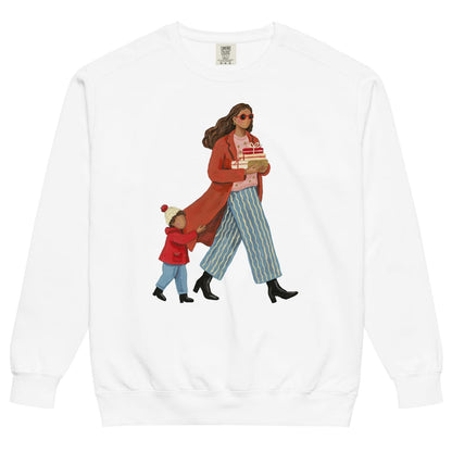 Wrapped & Running™ sweatshirt by Blossombless.co in White, front view: a mom in a long red coat and red sunglasses carrying wrapped gifts, her toddler holding the hem of her coat, in a soft gouache style