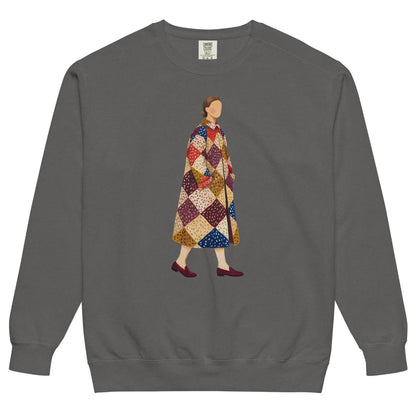 Pieced Together™ sweatshirt by Blossombless.co in Pepper, front view: a hand-painted faceless woman walking in an oversized patchwork coat of burgundy, mustard, cream, red and navy diamonds